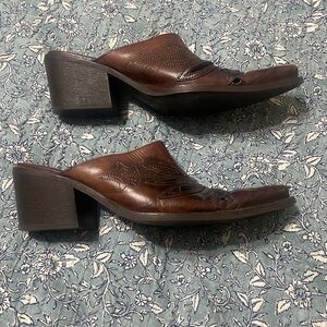 Leather slide-on pointed-toe heeled booties. 9